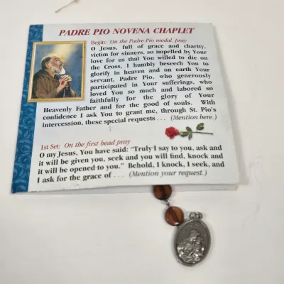 LOT 52: Statue Depicting the Infant Jesus of Prague, Multiple Scapulars, Italian-made Crucifix Pendant, and More
