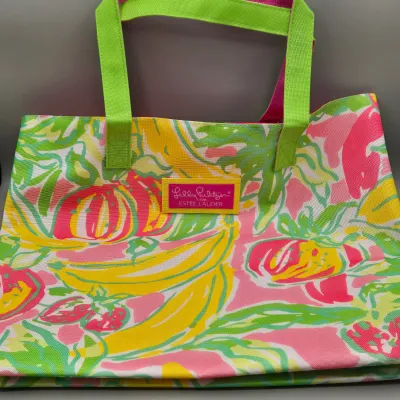 LOT 153: Lilly Pulitzer for Estée Lauder Tropical Print Tote Bag, Mustard Yellow Forever Young Crossbody Bag, and Multiple Storage Dust...