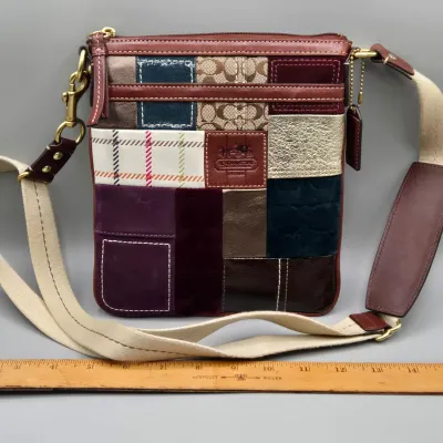 LOT 140: Coach Holiday Patchwork Swing Pack Shoulder Bag
