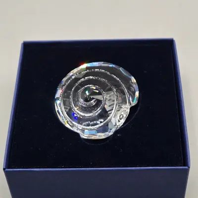 LOT 122: SWAROVSKI Crystal Snail Shell Wonder of The Sea, Scalloped Shell, Swan, and Frog Prince Figurines/ All in Original Boxes