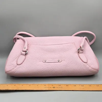 LOT 142: Pink Pebbled Leather Handbag from the Cole Haan Village Collection