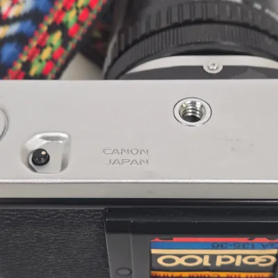 LOT 42: Vintage Canon AE-1 35mm SLR Film Camera with Telephoto Zoom Lense and Strap