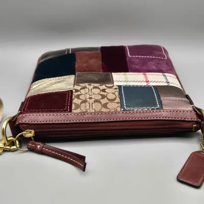 LOT 140: Coach Holiday Patchwork Swing Pack Shoulder Bag