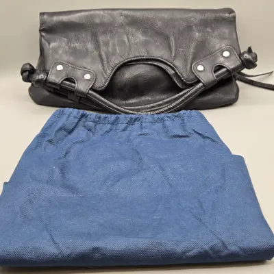 LOT 157: Black Leather Foldover Handbag by Pietro Alessandro