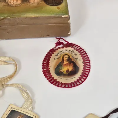 LOT 52: Statue Depicting the Infant Jesus of Prague, Multiple Scapulars, Italian-made Crucifix Pendant, and More