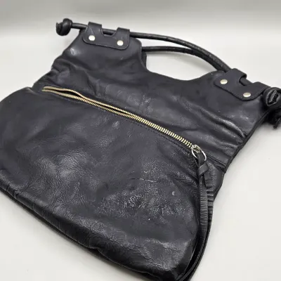 LOT 157: Black Leather Foldover Handbag by Pietro Alessandro