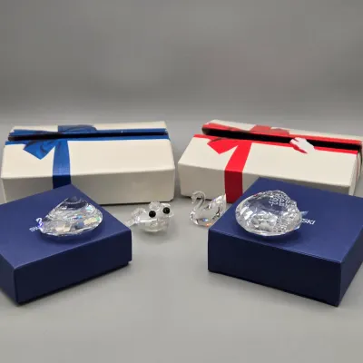 LOT 122: SWAROVSKI Crystal Snail Shell Wonder of The Sea, Scalloped Shell, Swan, and Frog Prince Figurines/ All in Original Boxes