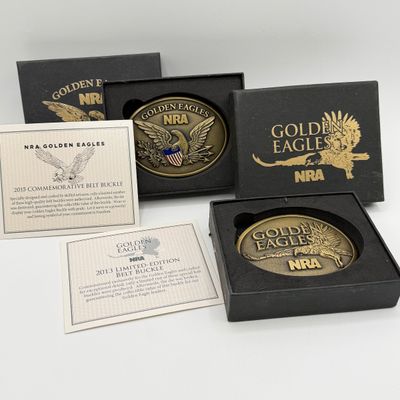 LOT 81: Two NRA Golden Eagles Commemorative Belt Buckles