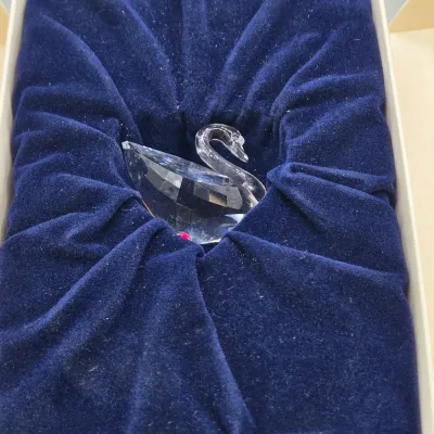 LOT 122: SWAROVSKI Crystal Snail Shell Wonder of The Sea, Scalloped Shell, Swan, and Frog Prince Figurines/ All in Original Boxes
