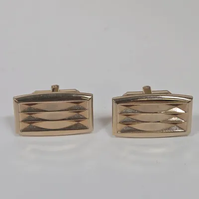 LOT 54: Swank Tie Pin with Matching Cufflinks, Vintage Caravelle Wristwatch, Socony Gas 5 Year Pin, Gold-tone WWII Honorable Discharge...