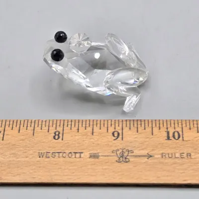 LOT 122: SWAROVSKI Crystal Snail Shell Wonder of The Sea, Scalloped Shell, Swan, and Frog Prince Figurines/ All in Original Boxes
