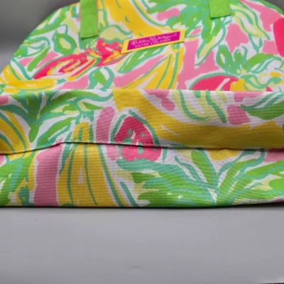 LOT 153: Lilly Pulitzer for Estée Lauder Tropical Print Tote Bag, Mustard Yellow Forever Young Crossbody Bag, and Multiple Storage Dust...