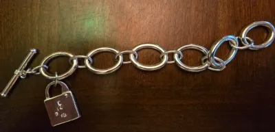 Sale Photo Thumbnail #12: Lauren Ralph Lauren 7" Chain Bracelet
This silver-tone Lauren Ralph Lauren chain link toggle bracelet features an engraved logo padlock charm.
pre owned great condition.