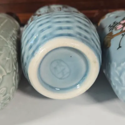 LOT 132F: Large Collection of Antique Japanese Military Sake Cups, Four Sake Bottles, and Beautiful Wood Chest for Storage