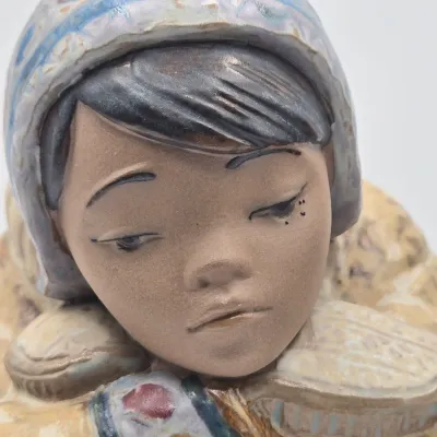 LOT 47L: Lladró "Pensive Eskimo Boy", "Pensive Eskimo Girl" Figurines, and "Attentive Polar Bear" Figurine
