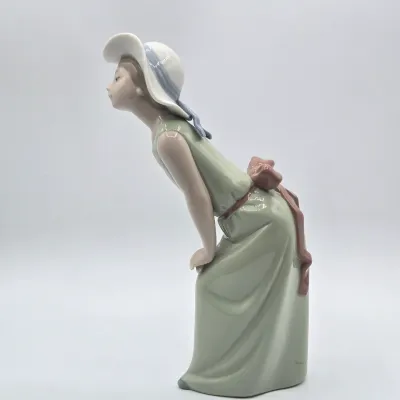 LOT 40L: Retired Lladró "Curious Girl with Straw Hat" Porcelain Figurine