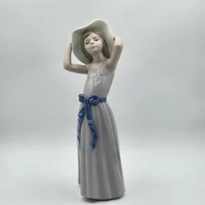 LOT 39L: Retired Lladró Porcelain Figurine Titled "Coy"