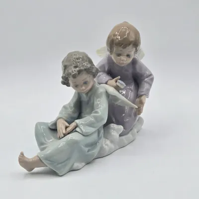 LOT 22L: Retired Lladró "Angel Care" Porcelain Figurine