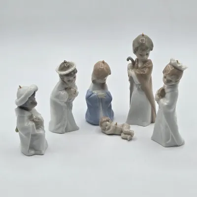 LOT 26L: Set of Retired Lladró Porcelain Nativity Ornaments Depicting the Holy Family and the Three Wise Men as Children