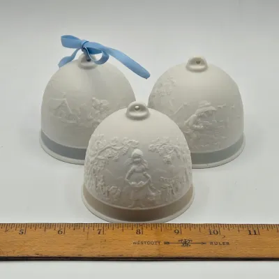 LOT 44L: Three Matte Porcelain Bell Ornaments from the Vintage Lladró Four Seasons Collector’s Society Series