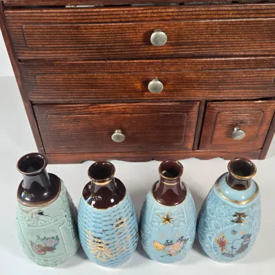 LOT 132F: Large Collection of Antique Japanese Military Sake Cups, Four Sake Bottles, and Beautiful Wood Chest for Storage
