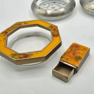 LOT 16L: Set of 4 Pewter Rimmed Glass Coasters, Vintage Matching Glass and Enamel Smoking Set Featuring an Octagonal Ashtray and a...