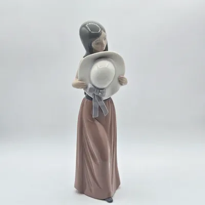 LOT 36L: Retired Lladró "Bashful Girl with Straw Hat" Porcelain Figurine