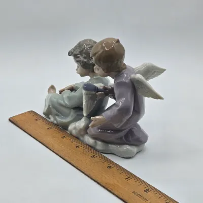 LOT 22L: Retired Lladró "Angel Care" Porcelain Figurine