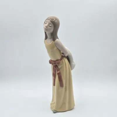 LOT 35L: Lladro "Naughty" Porcelain Figurine