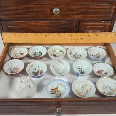 LOT 132F: Large Collection of Antique Japanese Military Sake Cups, Four Sake Bottles, and Beautiful Wood Chest for Storage