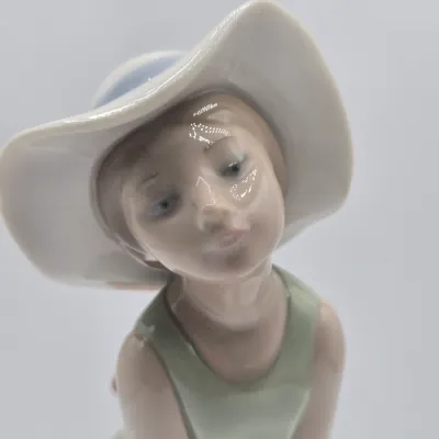 LOT 40L: Retired Lladró "Curious Girl with Straw Hat" Porcelain Figurine