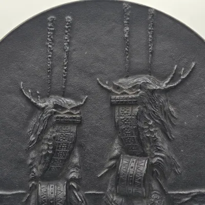 LOT 48L: Heavy Cast-iron Japanese Decorative Plate Featuring a Relief Carving of Traditional Deer Dancers Performing the Shishimai or...