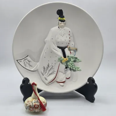 LOT 49L: Commemorative Ceramic Relief Decorative Plate Featuring a Jingu Bugaku Performer and Vintage Gourd-shaped Japanese Bell