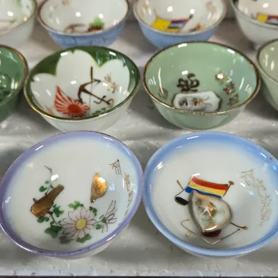 LOT 132F: Large Collection of Antique Japanese Military Sake Cups, Four Sake Bottles, and Beautiful Wood Chest for Storage
