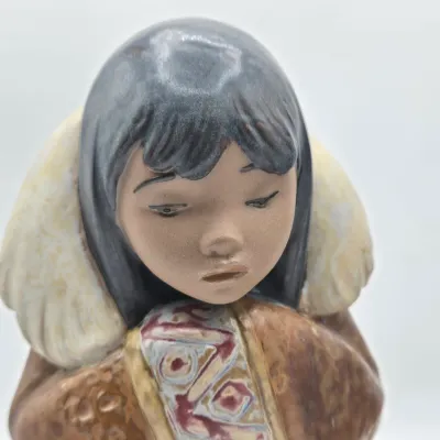 LOT 46L: Lladro "Artic Winter Girl" and "Poor Little Bear" Figurines
