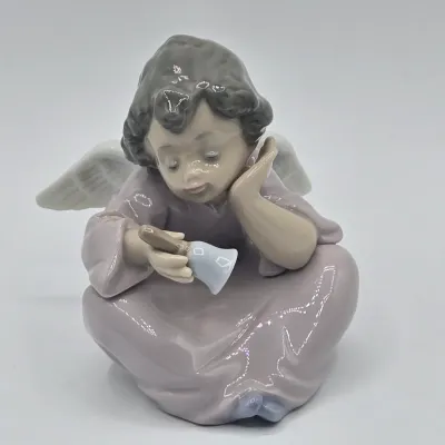LOT 29L: Retired Lladro "Heavenly Chimes" Porcelain Figurine
