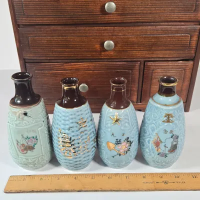 LOT 132F: Large Collection of Antique Japanese Military Sake Cups, Four Sake Bottles, and Beautiful Wood Chest for Storage