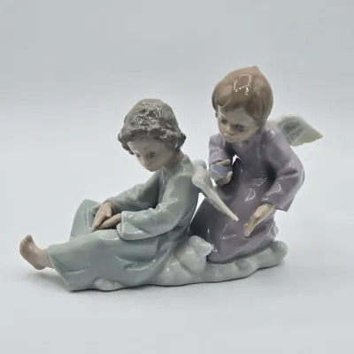 LOT 22L: Retired Lladró "Angel Care" Porcelain Figurine