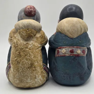 LOT 47L: Lladró "Pensive Eskimo Boy", "Pensive Eskimo Girl" Figurines, and "Attentive Polar Bear" Figurine