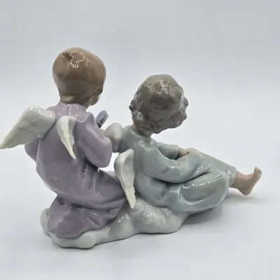 LOT 22L: Retired Lladró "Angel Care" Porcelain Figurine