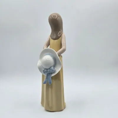 LOT 35L: Lladro "Naughty" Porcelain Figurine