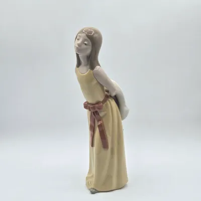 LOT 35L: Lladro "Naughty" Porcelain Figurine