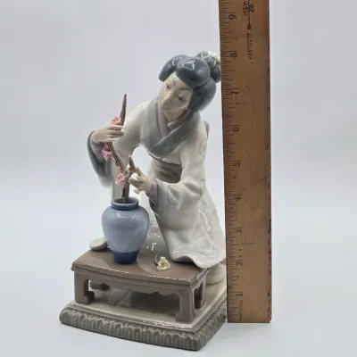 LOT 11L: Retired Lladró Porcelain Figurine Titled "Japanese Girl Decorating"
