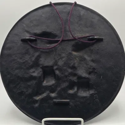LOT 48L: Heavy Cast-iron Japanese Decorative Plate Featuring a Relief Carving of Traditional Deer Dancers Performing the Shishimai or...