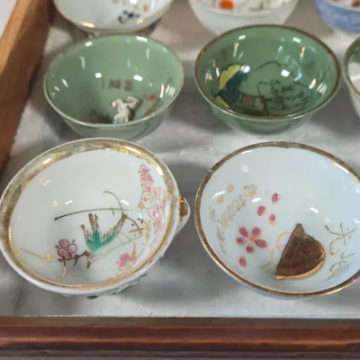 LOT 132F: Large Collection of Antique Japanese Military Sake Cups, Four Sake Bottles, and Beautiful Wood Chest for Storage