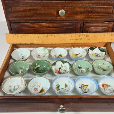 LOT 132F: Large Collection of Antique Japanese Military Sake Cups, Four Sake Bottles, and Beautiful Wood Chest for Storage