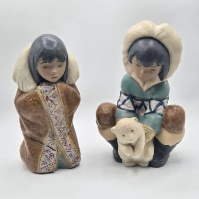 LOT 46L: Lladro "Artic Winter Girl" and "Poor Little Bear" Figurines