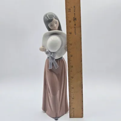 LOT 36L: Retired Lladró "Bashful Girl with Straw Hat" Porcelain Figurine