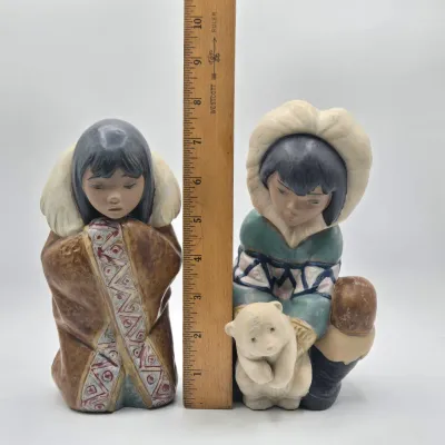 LOT 46L: Lladro "Artic Winter Girl" and "Poor Little Bear" Figurines
