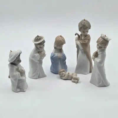 LOT 26L: Set of Retired Lladró Porcelain Nativity Ornaments Depicting the Holy Family and the Three Wise Men as Children